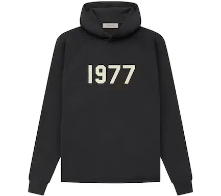 Fear of God Essentials delivered their Fear of God Essentials 1977 Knit Hoodie in Iron alongside more than 150 new apparel items in March of 2022.