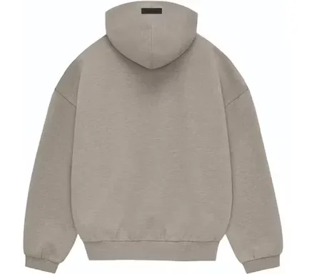 The Essentials hoodie provides volume in the body and sleeves with the intent of creating a soft, round, cropped silhouette.