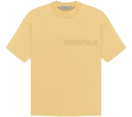 The Fear of God Essentials SS Tee Light Tuscan is a short-sleeved t-shirt made of a lightweight cotton jersey. It features a crew neck and a screen-printed logo on the chest.